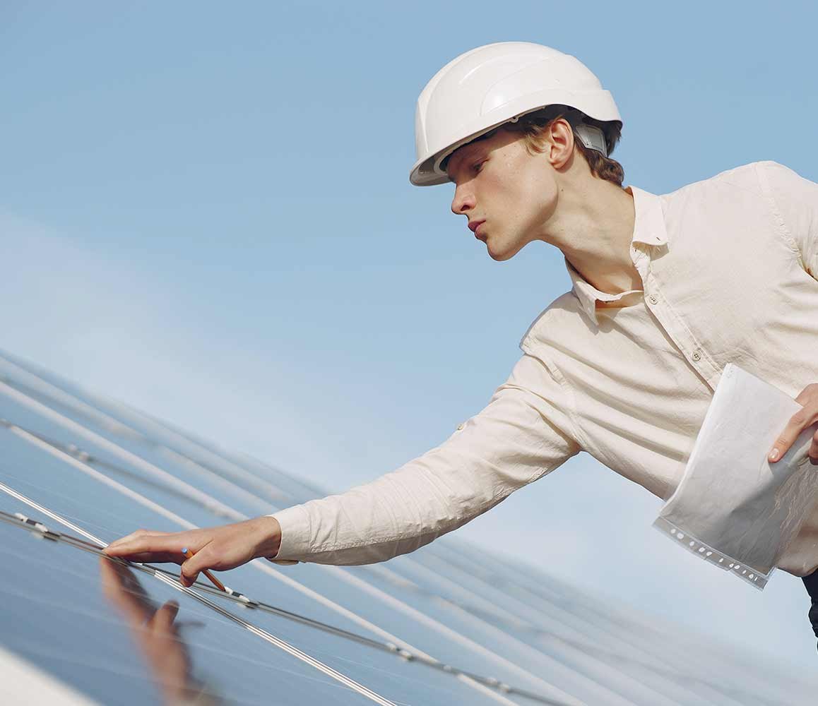 Person Checking Solar Panels Person Checking Solar Panels